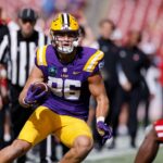 TAMPA, FL - JANUARY 01: LSU Tigers tight end Mason Taylor (86) runs with the ball after catching a pass during the ReliaQuest Bowl against the Wisconsin Badgers on January 1, 2024 at Raymond James Stadium in Tampa, Florida. (Photo by Joe Robbins/Icon Spor