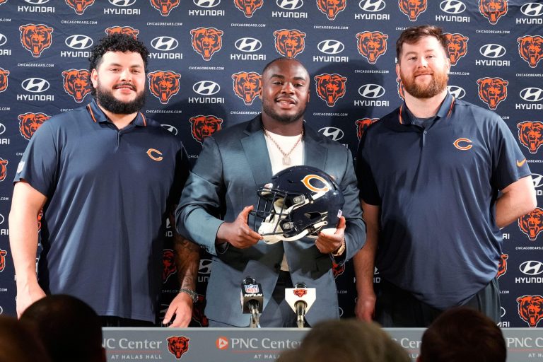 Chicago Bears football guard Jonah Jackson, left, defensive tackle Grady Jarrett, center, and football guard Joe Thuney, pose for photo during a news conference at Halas Hall in Lake Forest, Ill., Wednesday, March 12, 2025. (AP Photo/Nam Y. Huh)