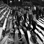 Police inspecting wooden bleachers that collapsed during a football game at Ladd Stadium in Mobile, Alabama.