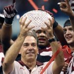 File photo of Alabama Crimson Tide head coach Saban holding the BCS trophy after defeating the LSU Tigers in their NCAA BCS National Championship college football game in New Orleans