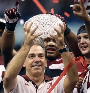 File photo of Alabama Crimson Tide head coach Saban holding the BCS trophy after defeating the LSU Tigers in their NCAA BCS National Championship college football game in New Orleans